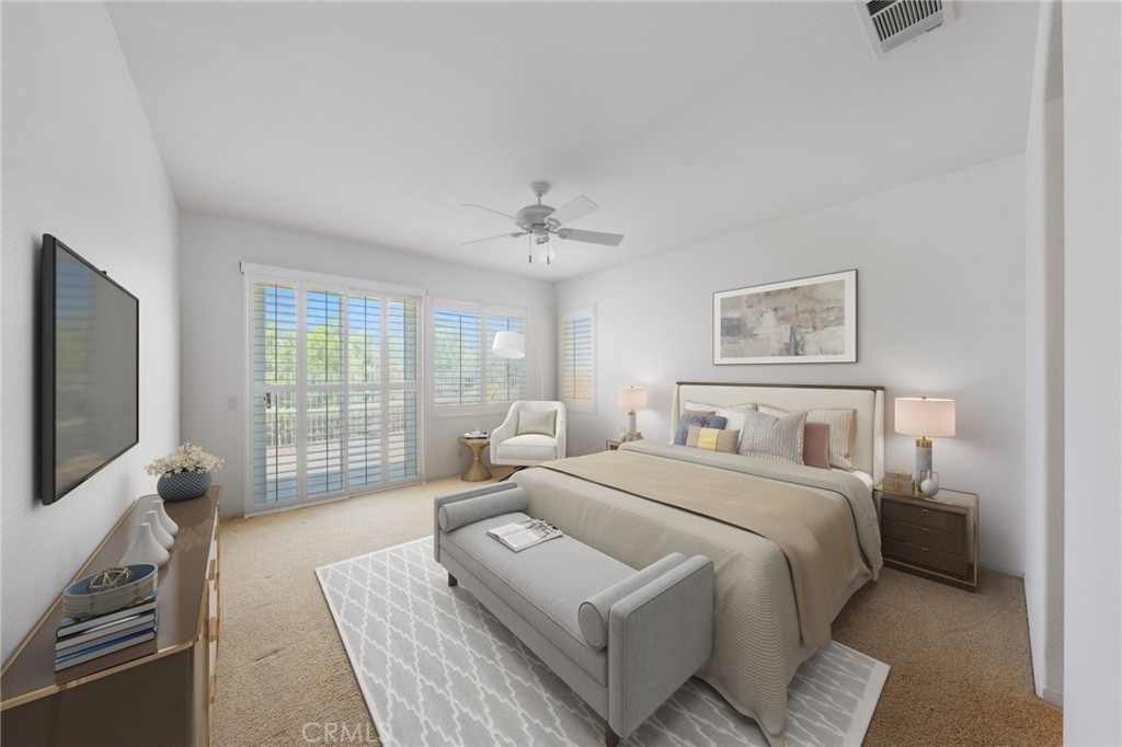 31256 Firestone Street Temecula, CA 92591 - Photo 8 of 56 a bedroom with a large bed and a flat screen tv