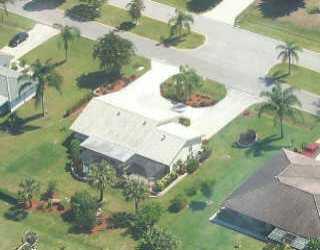 113 North W Everglades Boulevard Stuart, FL 34994 - Photo 1 of 8 a view of a garden with a yard