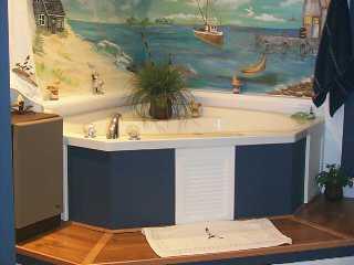 113 North W Everglades Boulevard Stuart, FL 34994 - Photo 7 of 8 a bathroom with a sink and a mirror