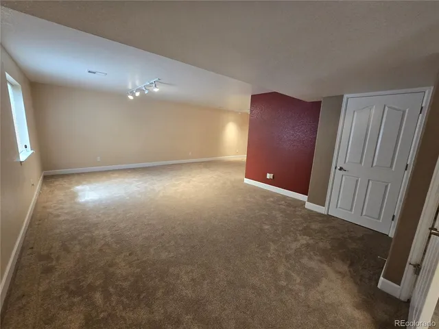 en empty room with windows and closet