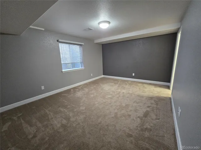 en empty room with windows