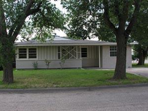 4000 Gables Street Amarillo, TX 79110 - Photo 1 of 4 a front view of a house with a garden