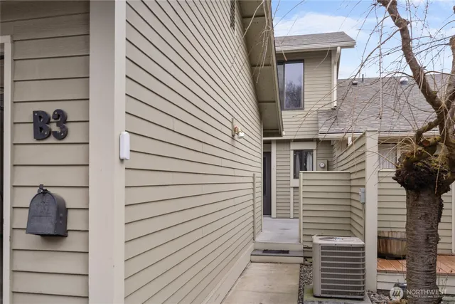 a view of a house with a door and wooden floor