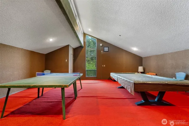 a room with furniture and pool table