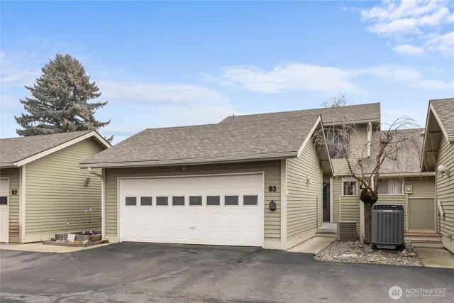 a front view of a house with a garage