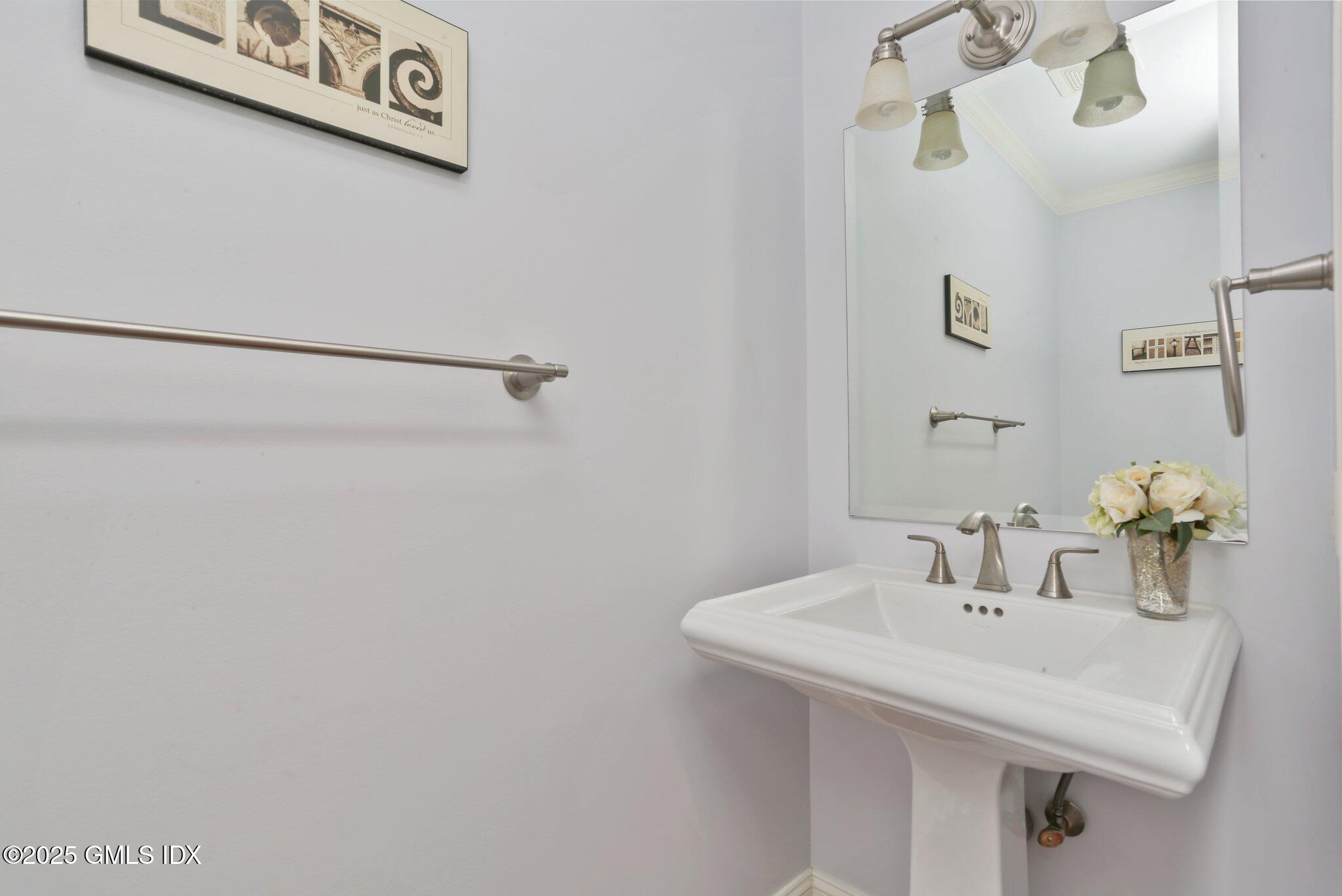 112 Old Belden Hill Road Wilton, CT 06897 - Photo 11 of 38 a bathroom with a sink and a mirror