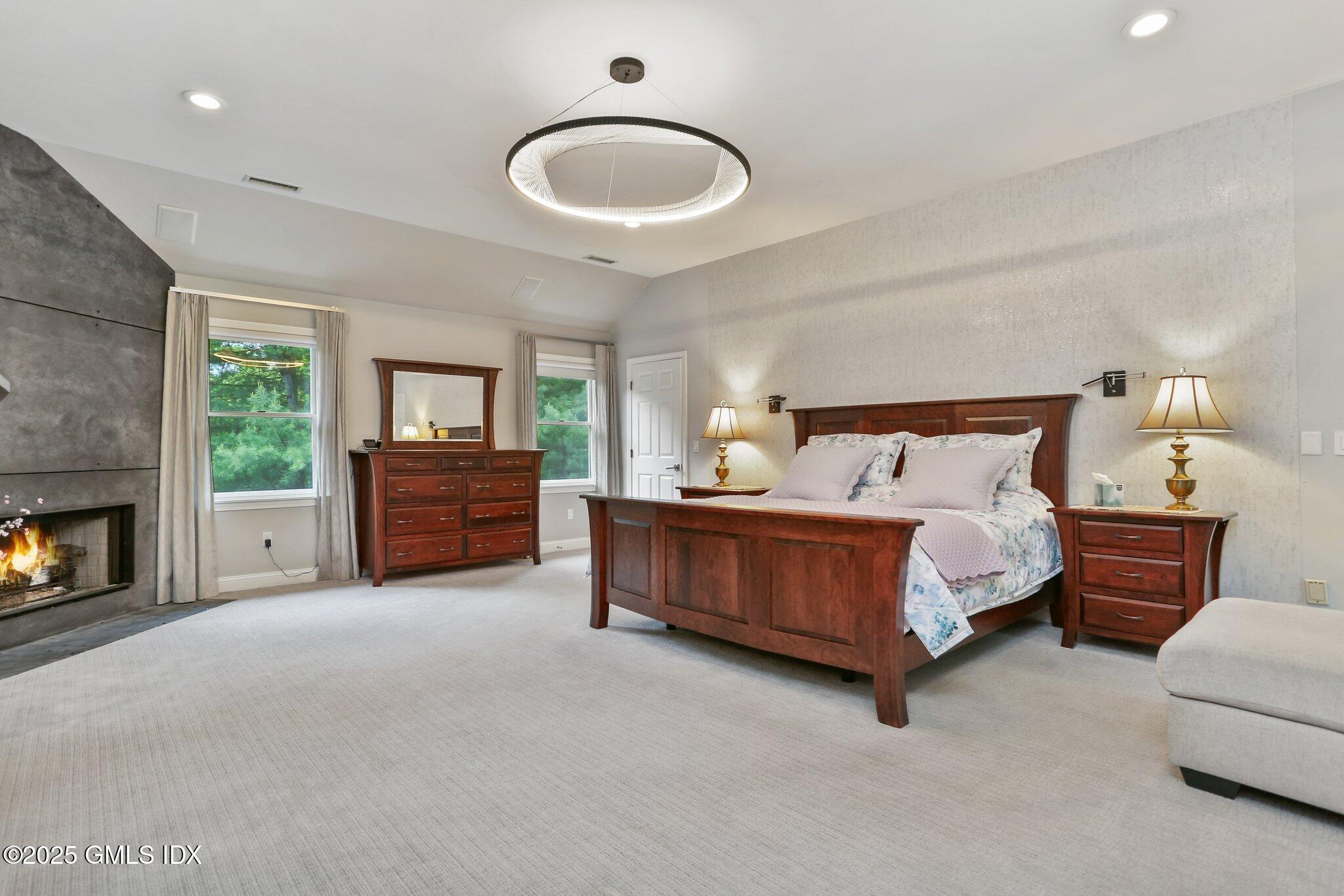 112 Old Belden Hill Road Wilton, CT 06897 - Photo 12 of 38 a bedroom with a bed couch and window