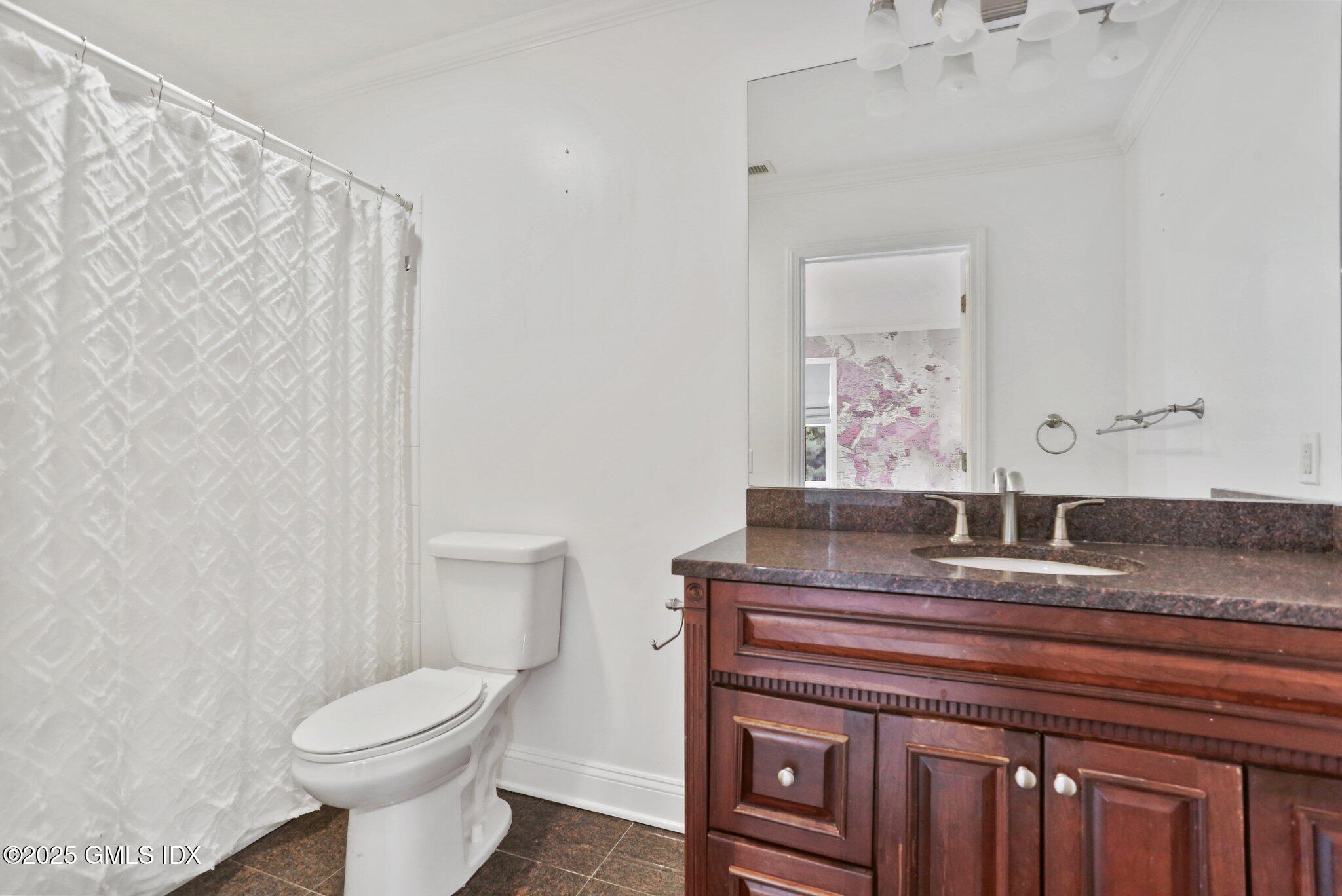 112 Old Belden Hill Road Wilton, CT 06897 - Photo 18 of 38 a bathroom with a toilet sink and mirror