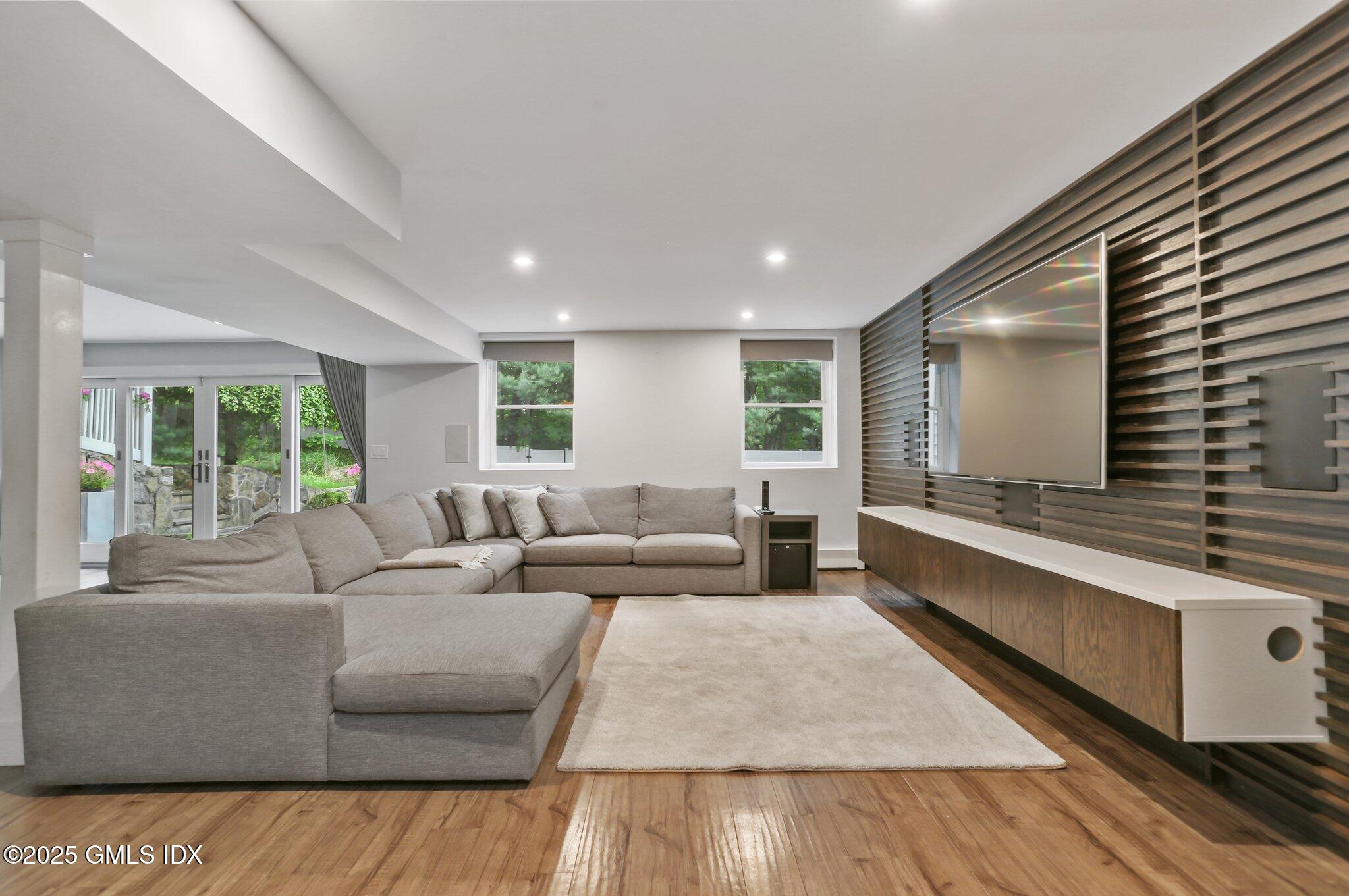 112 Old Belden Hill Road Wilton, CT 06897 - Photo 23 of 38 a living room with furniture and a large window