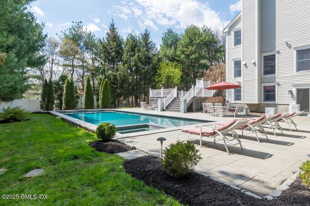 112 Old Belden Hill Road Wilton, CT 06897 - Photo 27 of 38 a view of a swimming pool with a patio