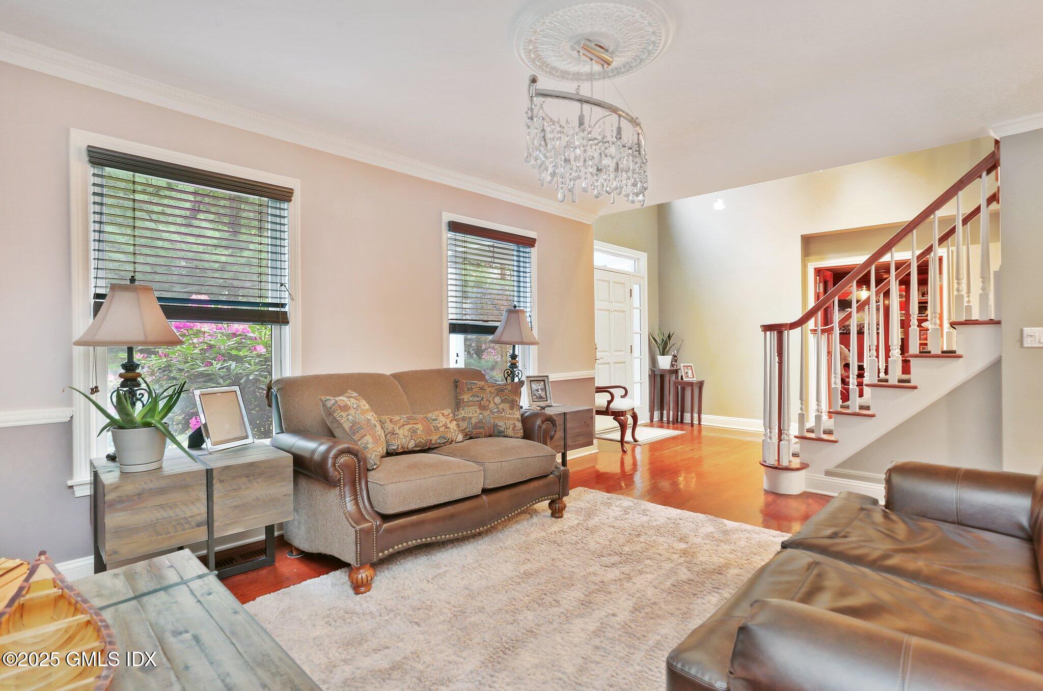 112 Old Belden Hill Road Wilton, CT 06897 - Photo 3 of 38 a living room with furniture and a large window