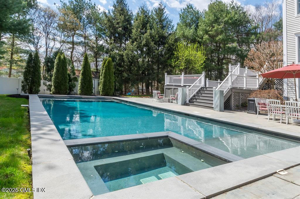 112 Old Belden Hill Road Wilton, CT 06897 - Photo 33 of 38 a view of a swimming pool with a patio