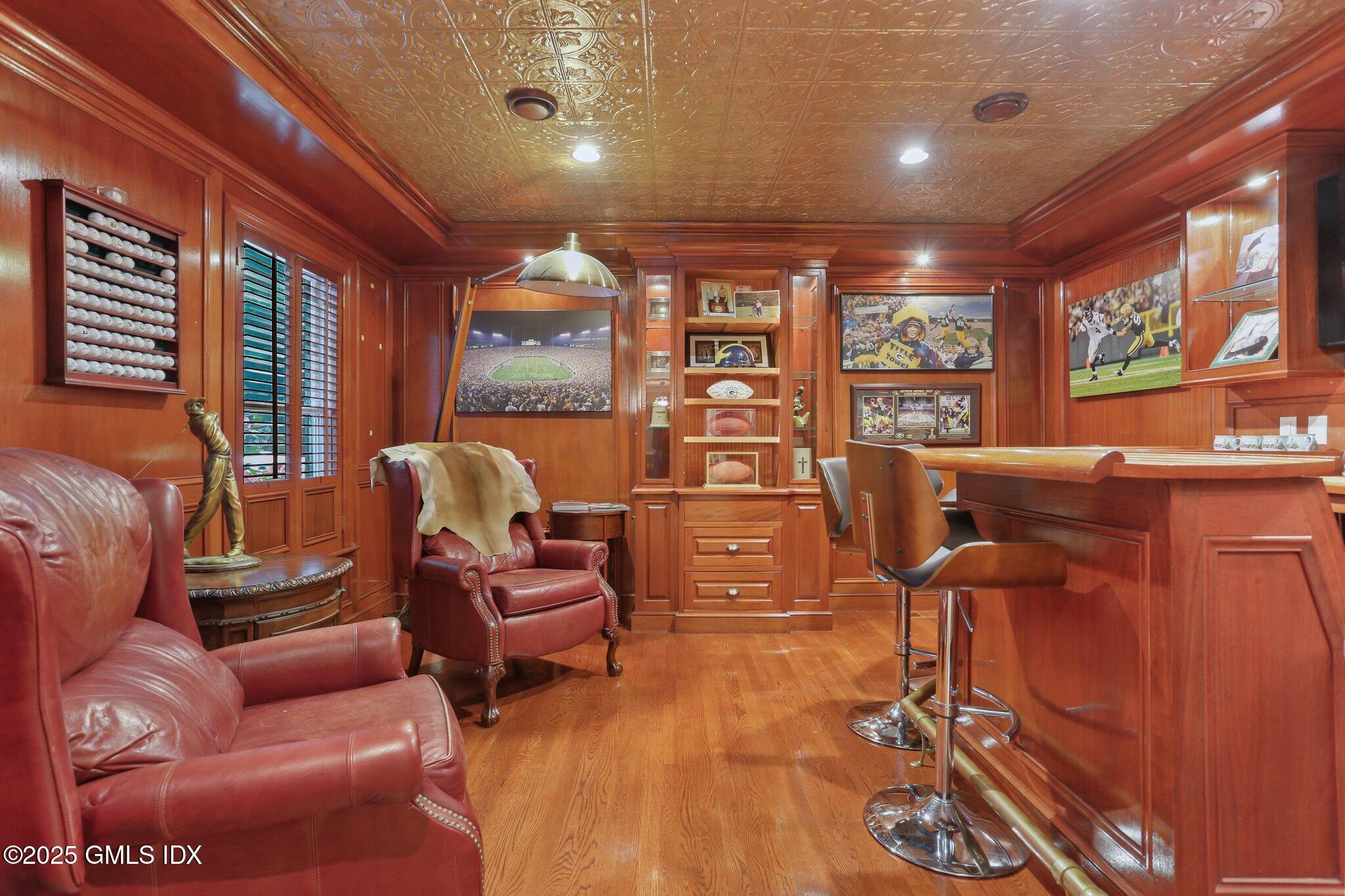 112 Old Belden Hill Road Wilton, CT 06897 - Photo 5 of 38 a living room with furniture and large windows