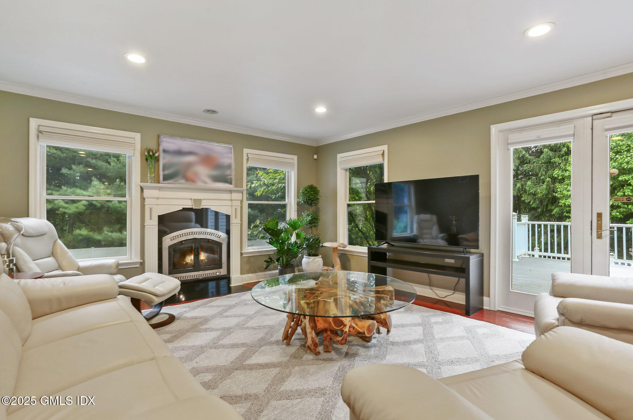 112 Old Belden Hill Road Wilton, CT 06897 - Photo 8 of 38 a living room with furniture a flat screen tv and a fireplace