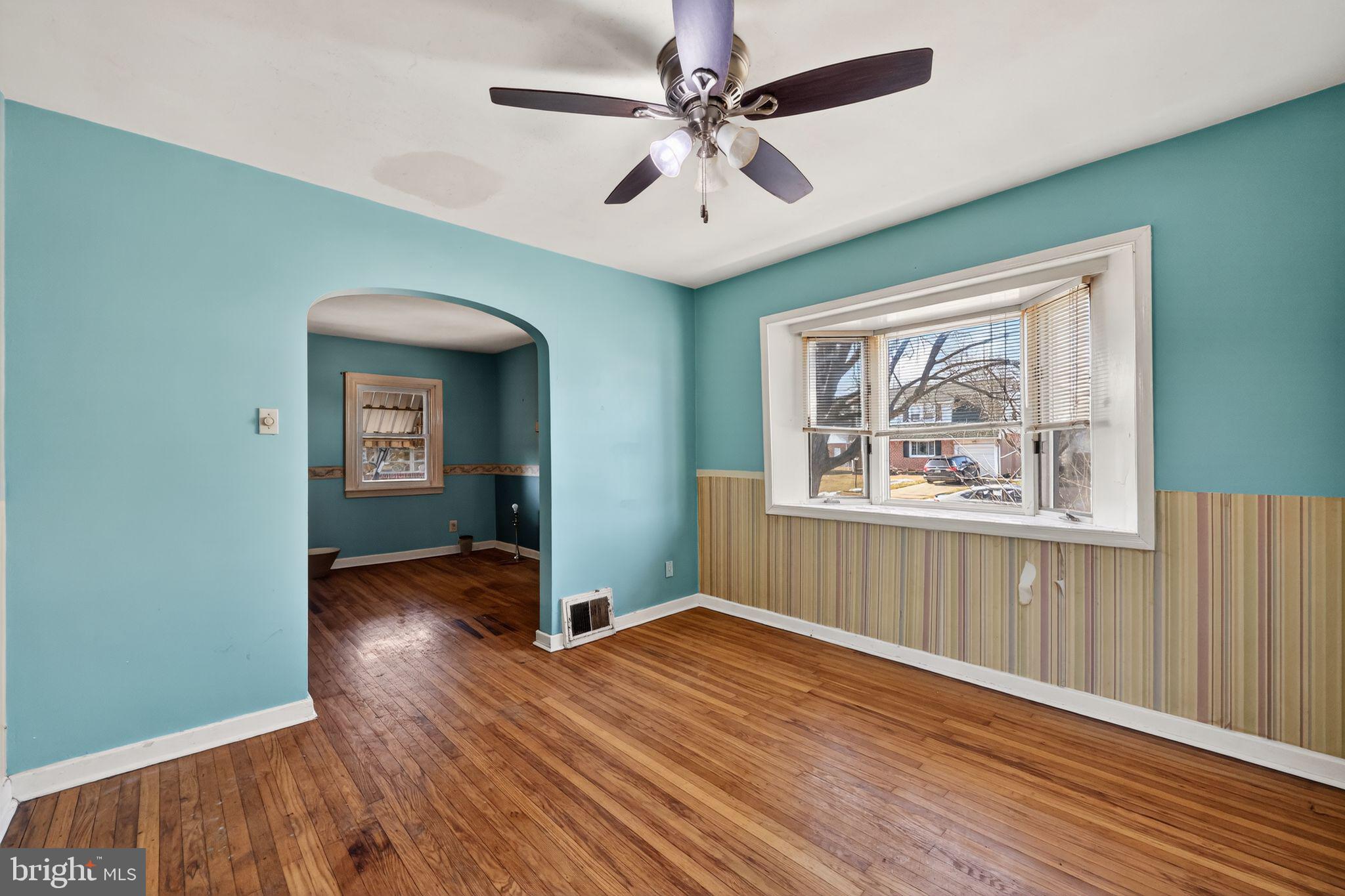1212 Meadow Road Woodlyn, PA 19094 - Photo 13 of 30 wooden floor in an empty room with a window
