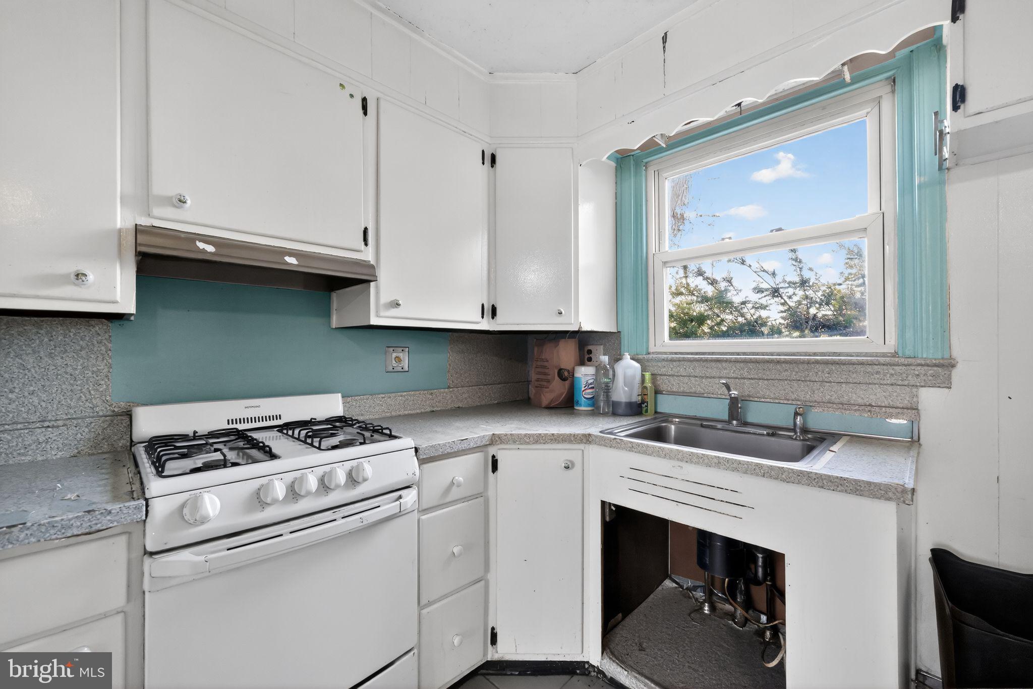1212 Meadow Road Woodlyn, PA 19094 - Photo 14 of 30 a kitchen with appliances cabinets and a sink