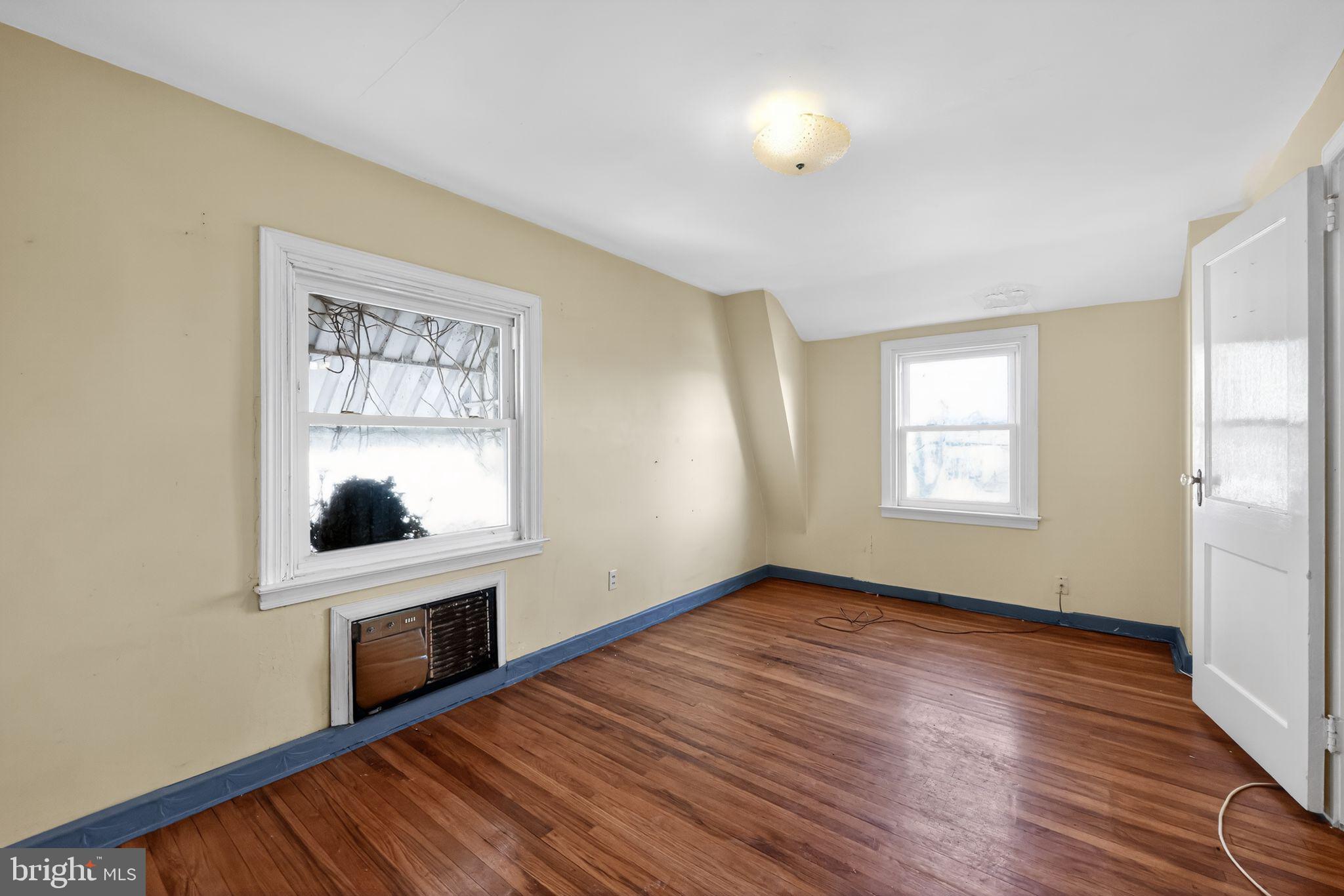1212 Meadow Road Woodlyn, PA 19094 - Photo 20 of 30 an empty room with windows and fireplace