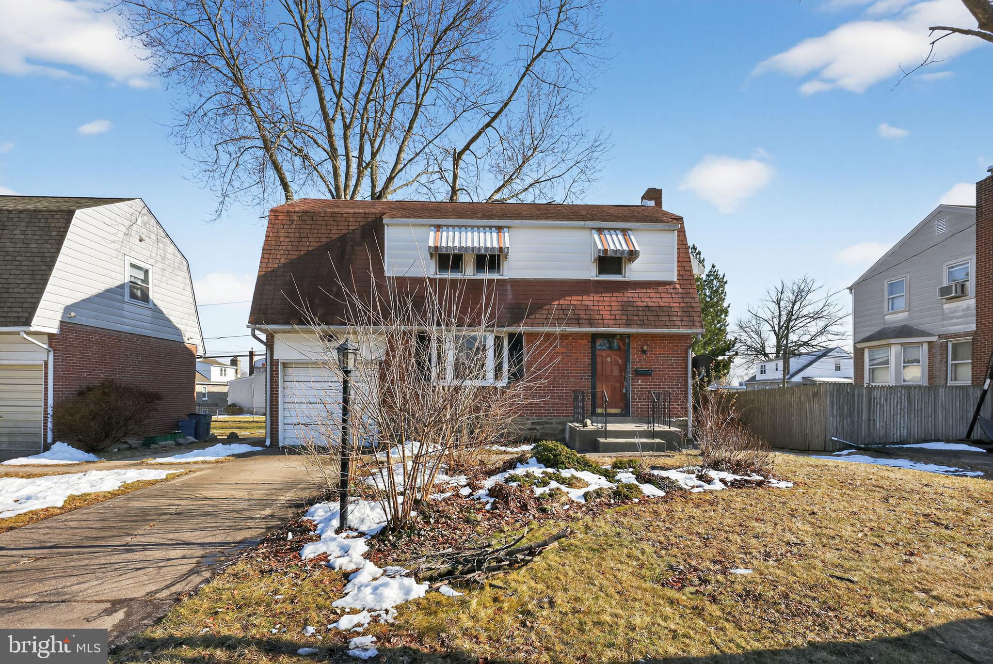 1212 Meadow Road Woodlyn, PA 19094 - Photo 2 of 30 a front view of a house with a yard