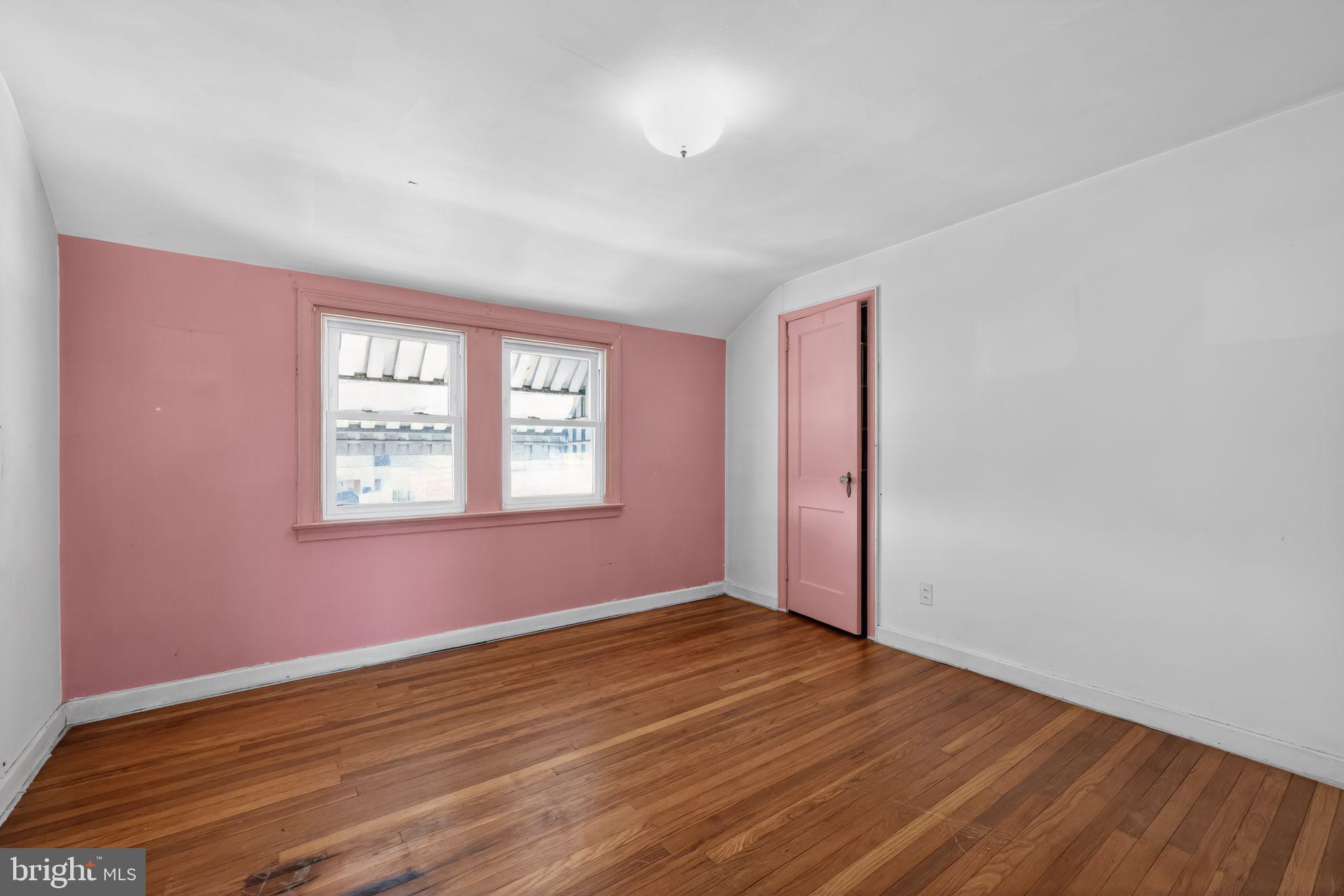 1212 Meadow Road Woodlyn, PA 19094 - Photo 23 of 30 an empty room with wooden floor and windows