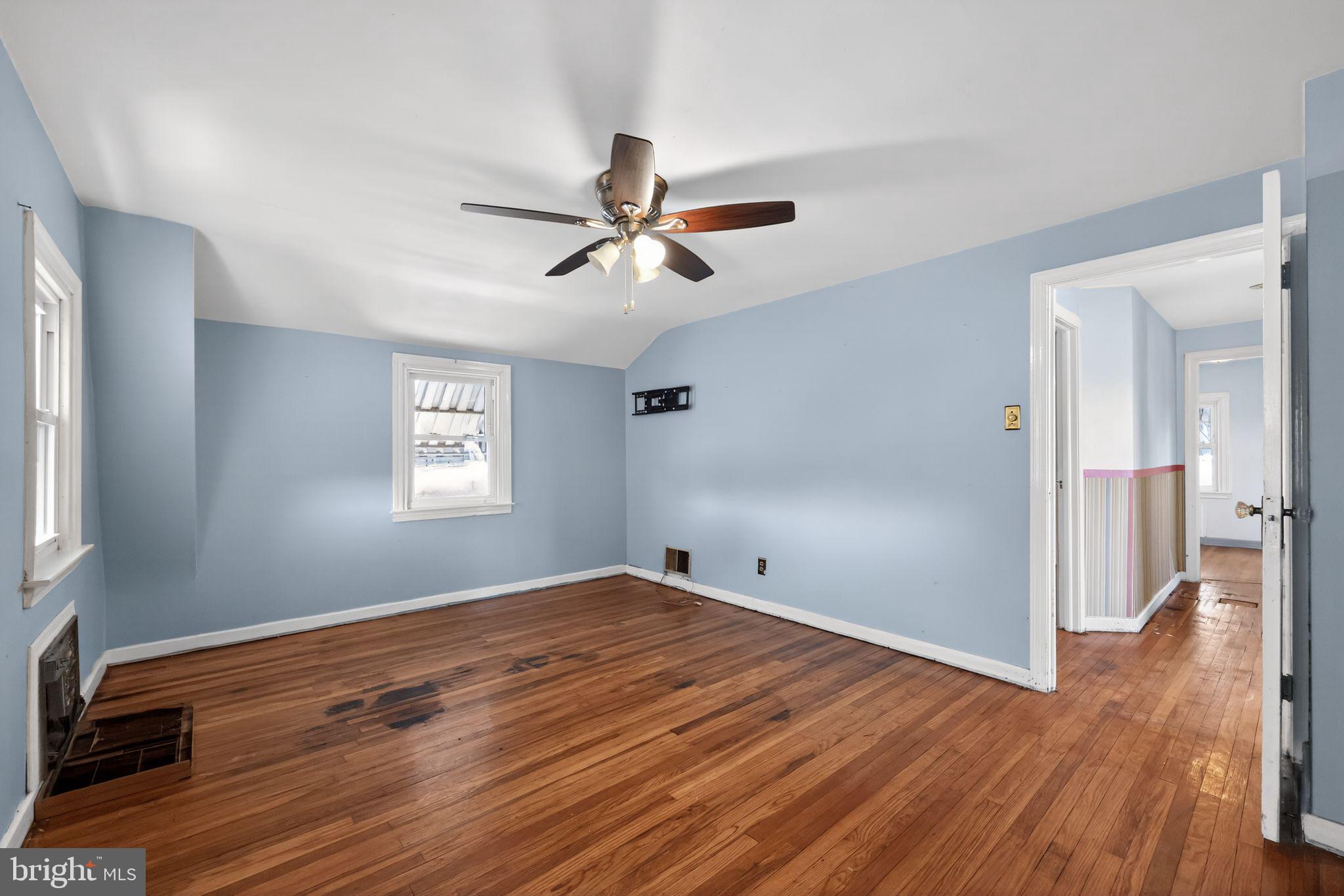 1212 Meadow Road Woodlyn, PA 19094 - Photo 24 of 30 a view of empty room with wooden floor and fan