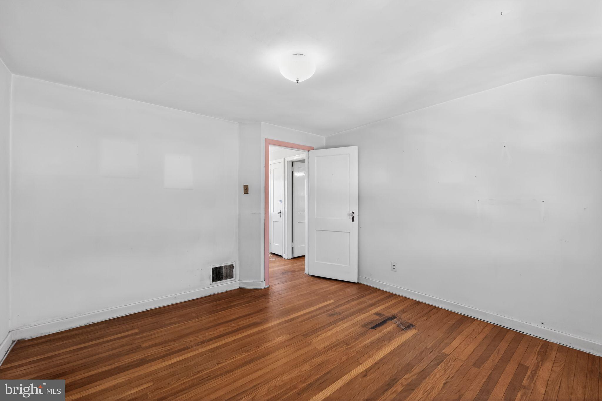 1212 Meadow Road Woodlyn, PA 19094 - Photo 25 of 30 a view of an empty room and wooden floor