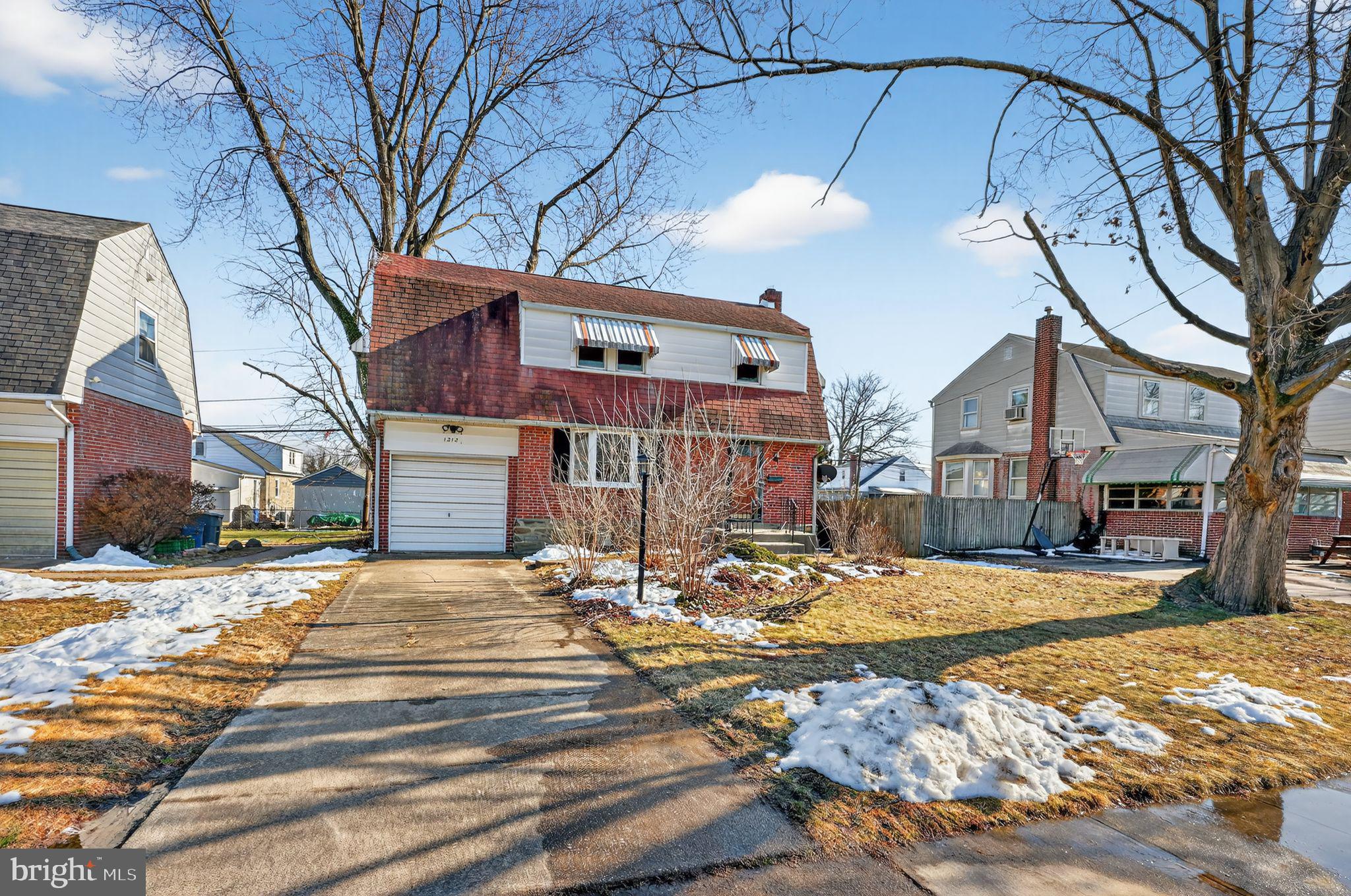 1212 Meadow Road Woodlyn, PA 19094 - Photo 4 of 30 a view of a house with a snow in the yard