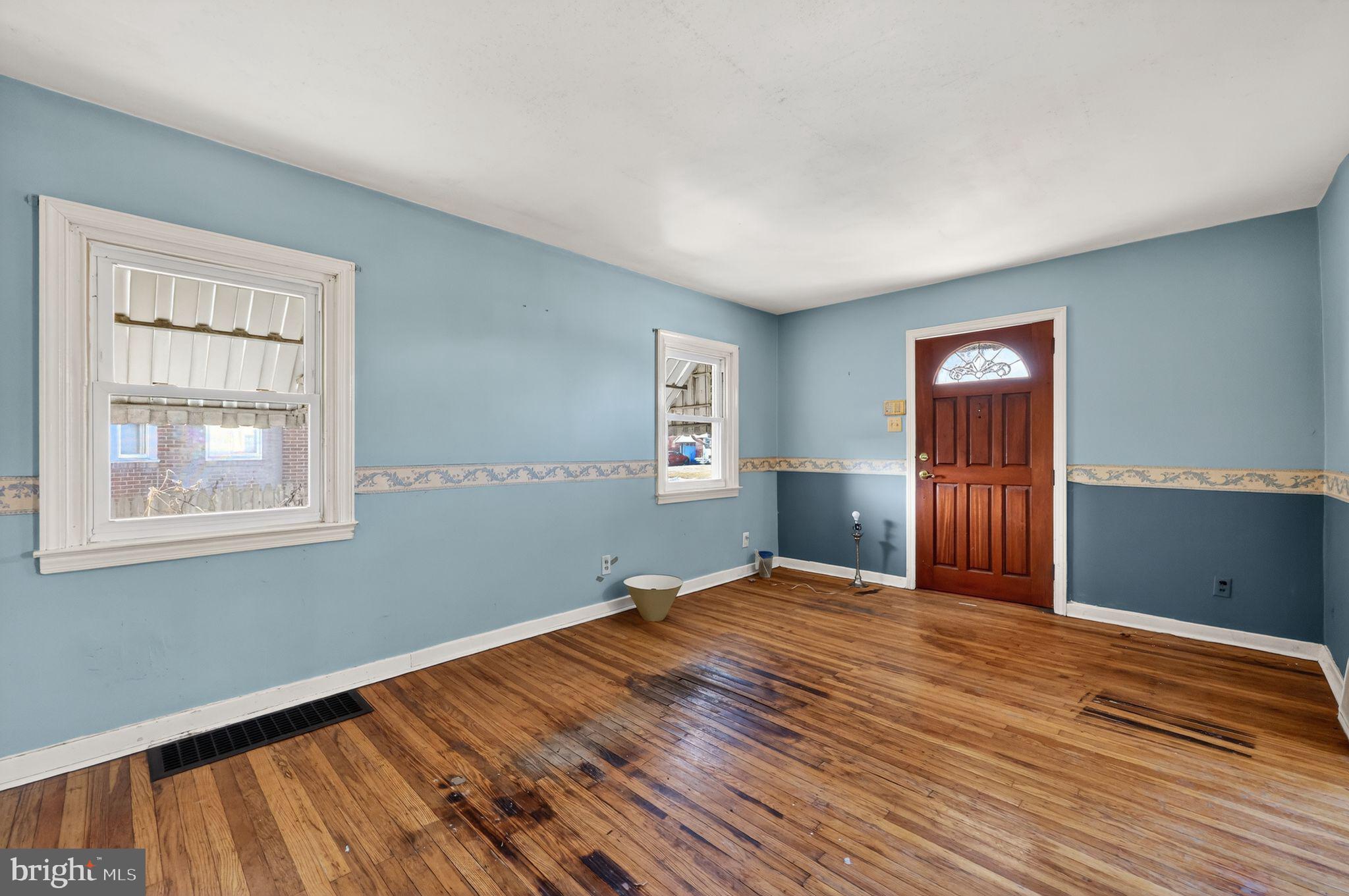 1212 Meadow Road Woodlyn, PA 19094 - Photo 6 of 30 a view of an empty room with wooden floor and a window