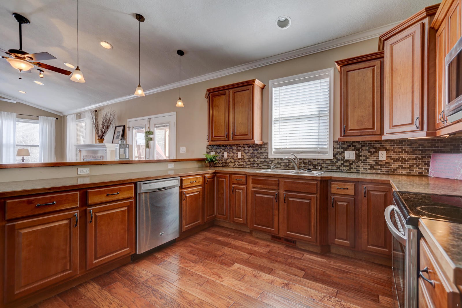 1013 Blockhouse Valley Road Clinton, TN 37716 - Photo 11 of 37 a large kitchen with a sink cabinets and wooden floor