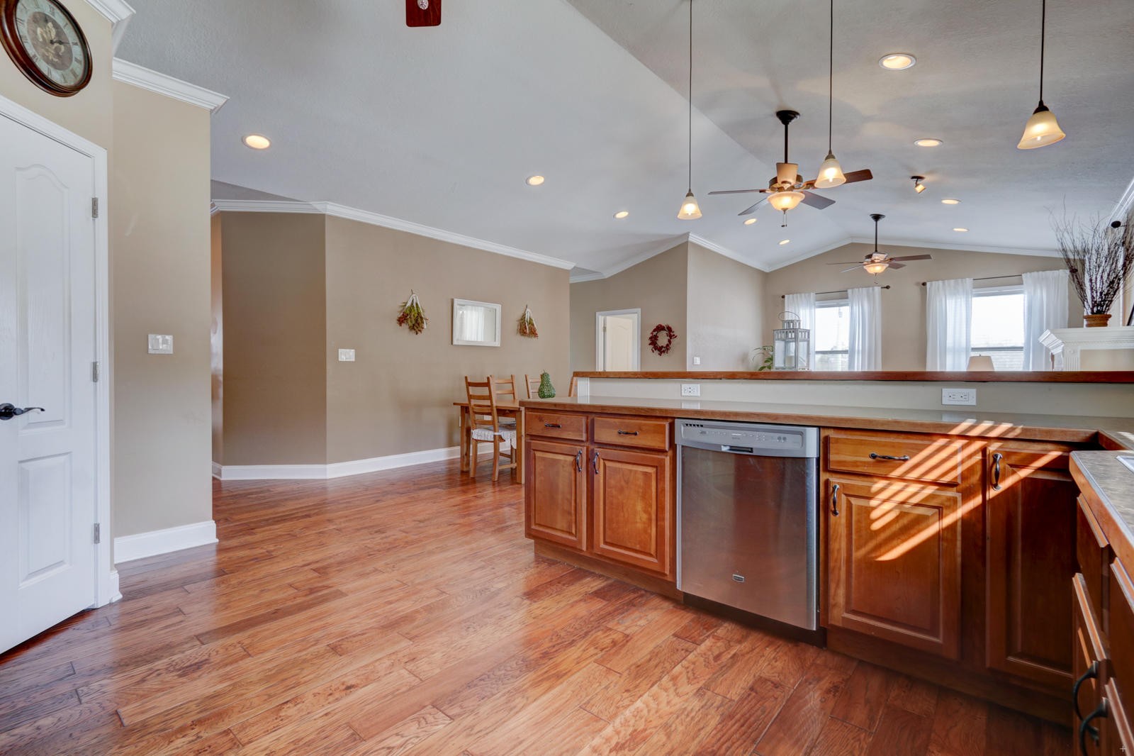 1013 Blockhouse Valley Road Clinton, TN 37716 - Photo 10 of 37 a kitchen with stainless steel appliances kitchen island granite countertop wooden floors and a sink