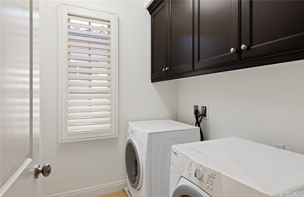 62 Cipresso Irvine, CA 92618 - Photo 23 of 49 a utility room with dryer and washer