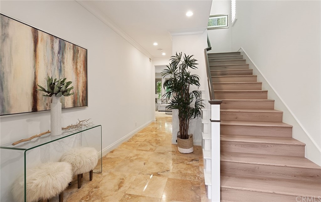 62 Cipresso Irvine, CA 92618 - Photo 3 of 49 a potted plant sitting on a floor in front of a house