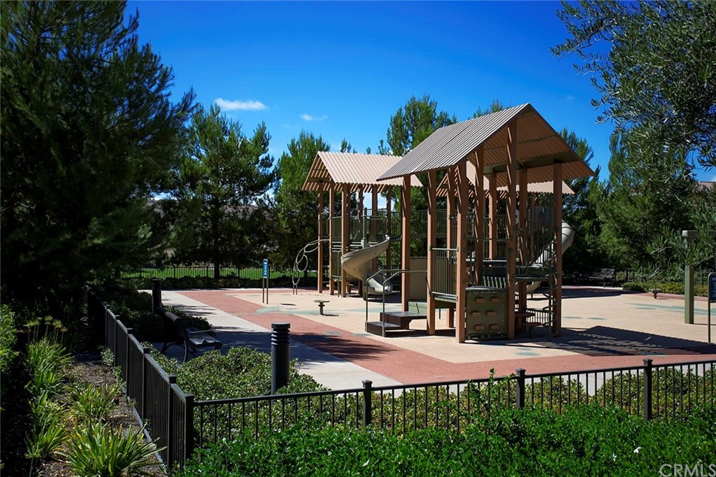 62 Cipresso Irvine, CA 92618 - Photo 38 of 49 a view of a wooden dinning table and chairs in patio