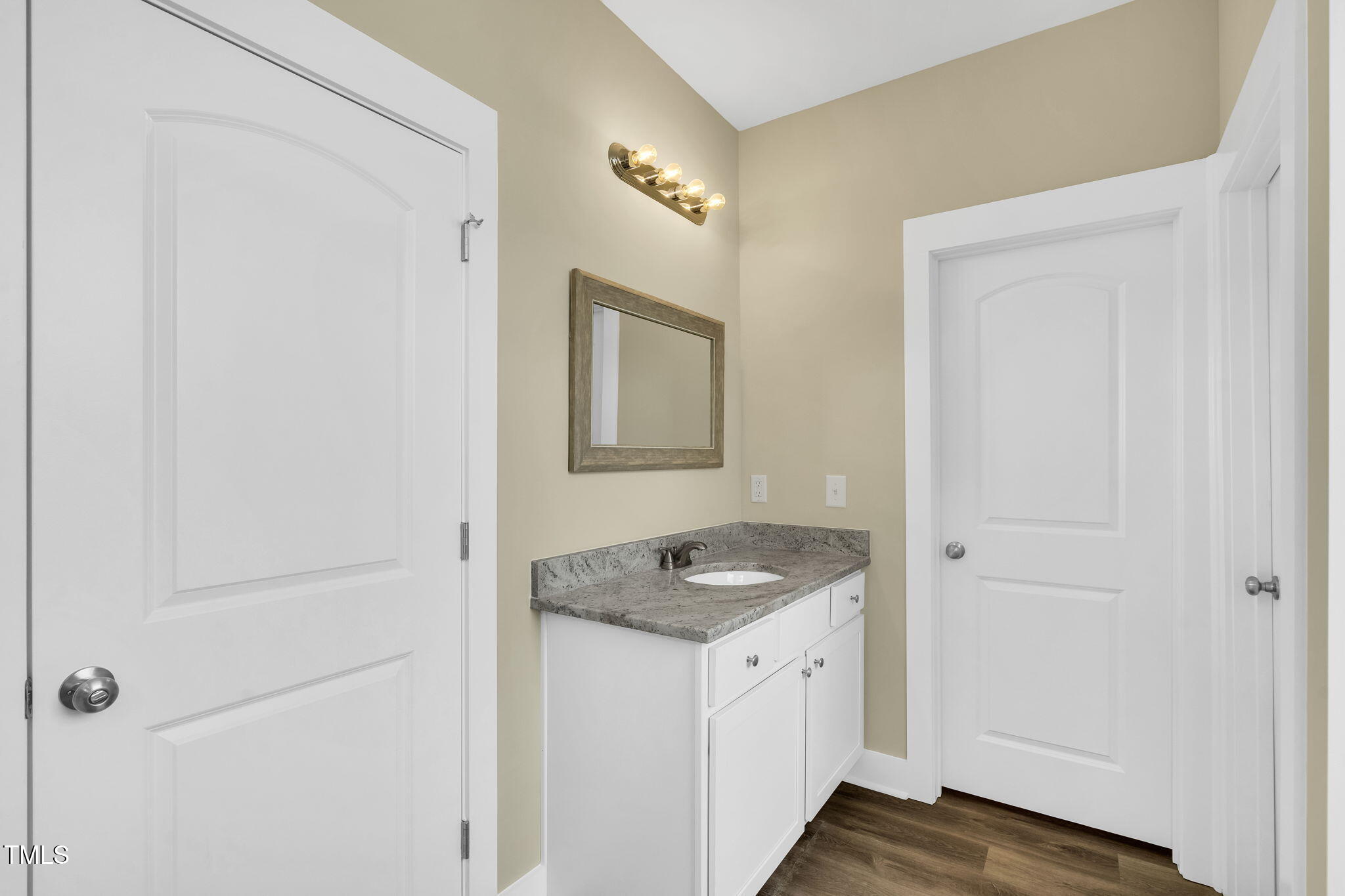 1076 Highway 55 Coats, NC 27521 - Photo 11 of 20 a bathroom with a granite countertop sink and a mirror