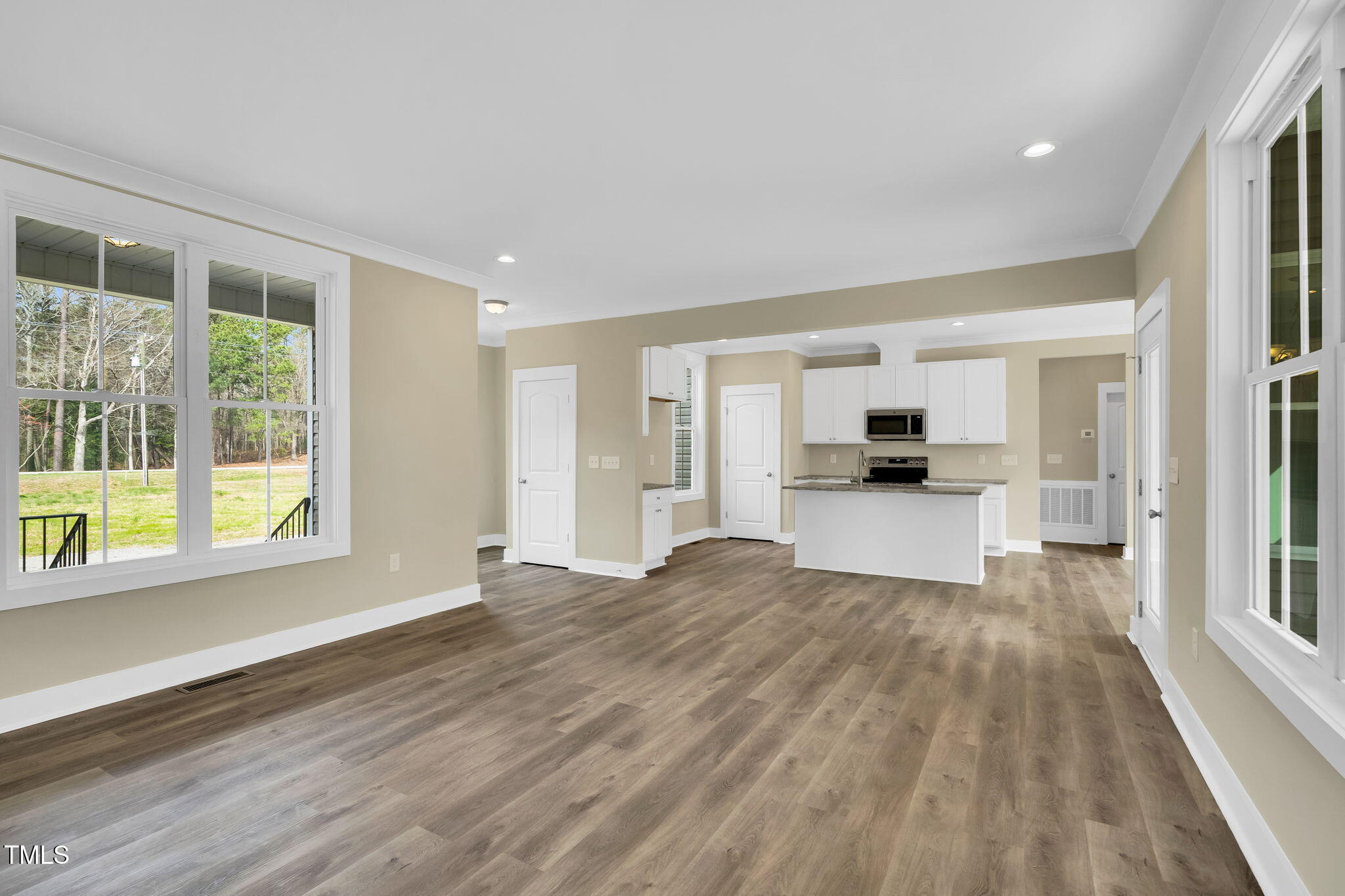 1076 Highway 55 Coats, NC 27521 - Photo 7 of 20 a view of empty room with wooden floor and windows