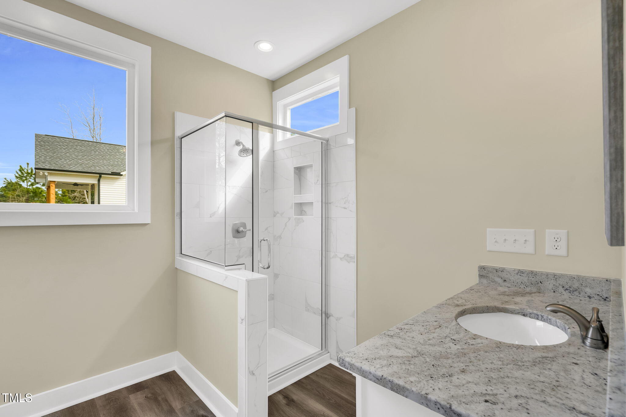 1076 Highway 55 Coats, NC 27521 - Photo 10 of 20 a bathroom with a granite countertop sink and a mirror