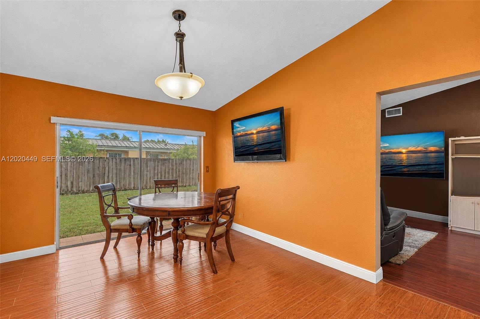11061 Southwest 163rd Street Miami, FL 33157 - Photo 9 of 42 a view of a dining room with furniture and wooden floor