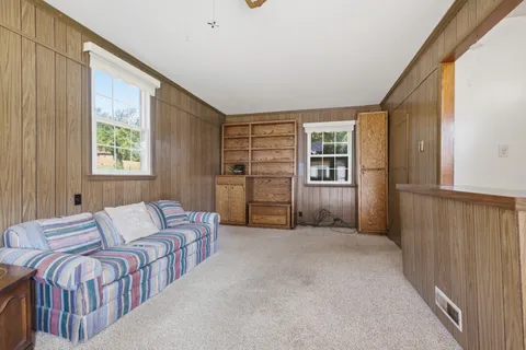 a spacious bedroom with a bed and a window