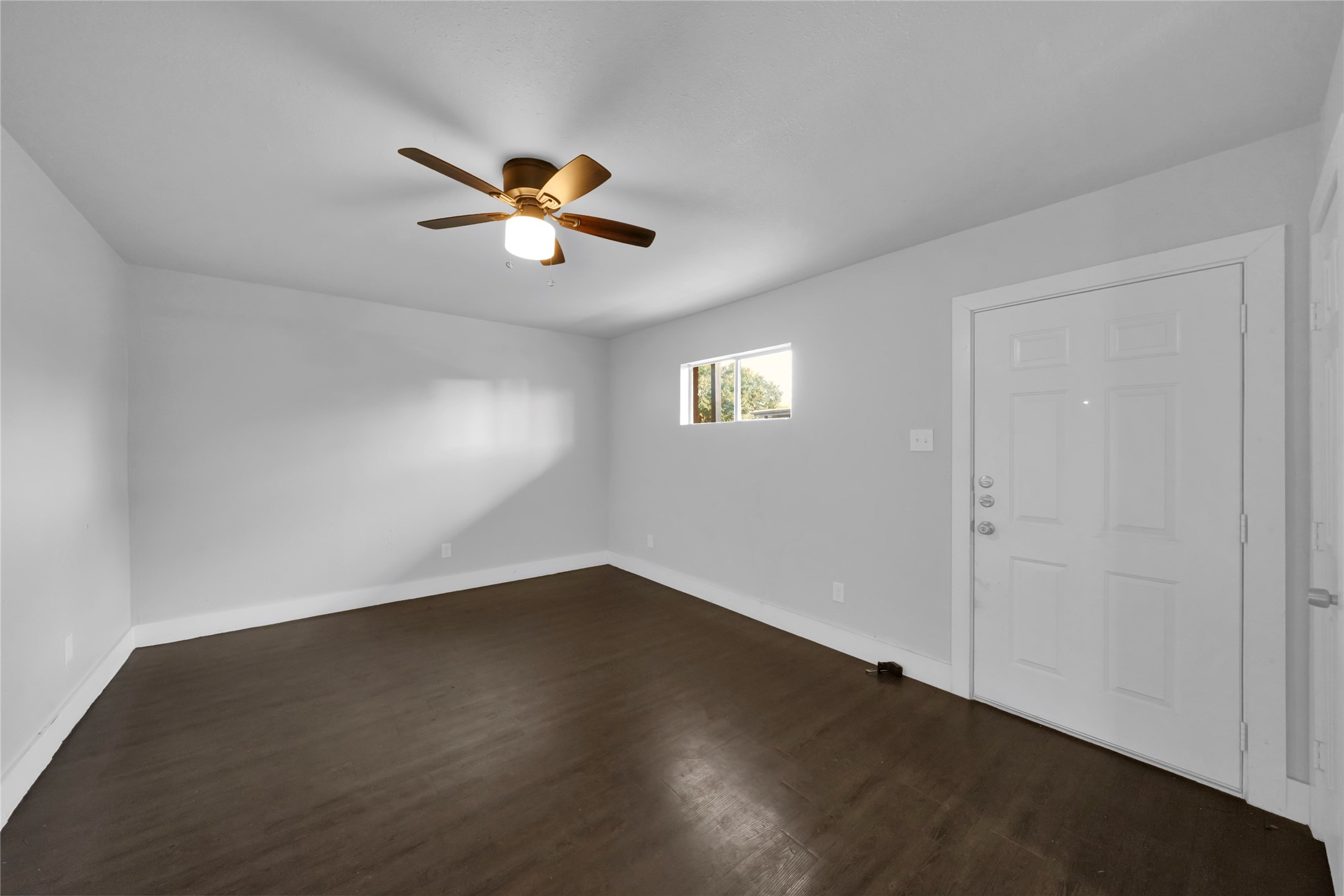 6518 Weston Street, Unit 11 Houston, TX 77021 - Photo 4 of 15 a view of a room with a ceiling fan and a window