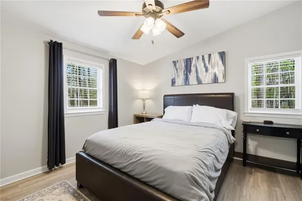 a bedroom with a large bed and a window