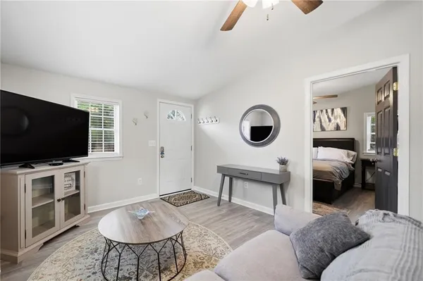 a living room with furniture and a flat screen tv