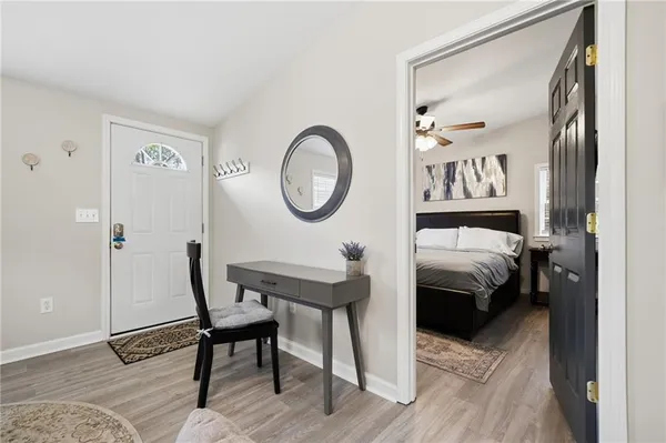 a bedroom with a bed and a table in it
