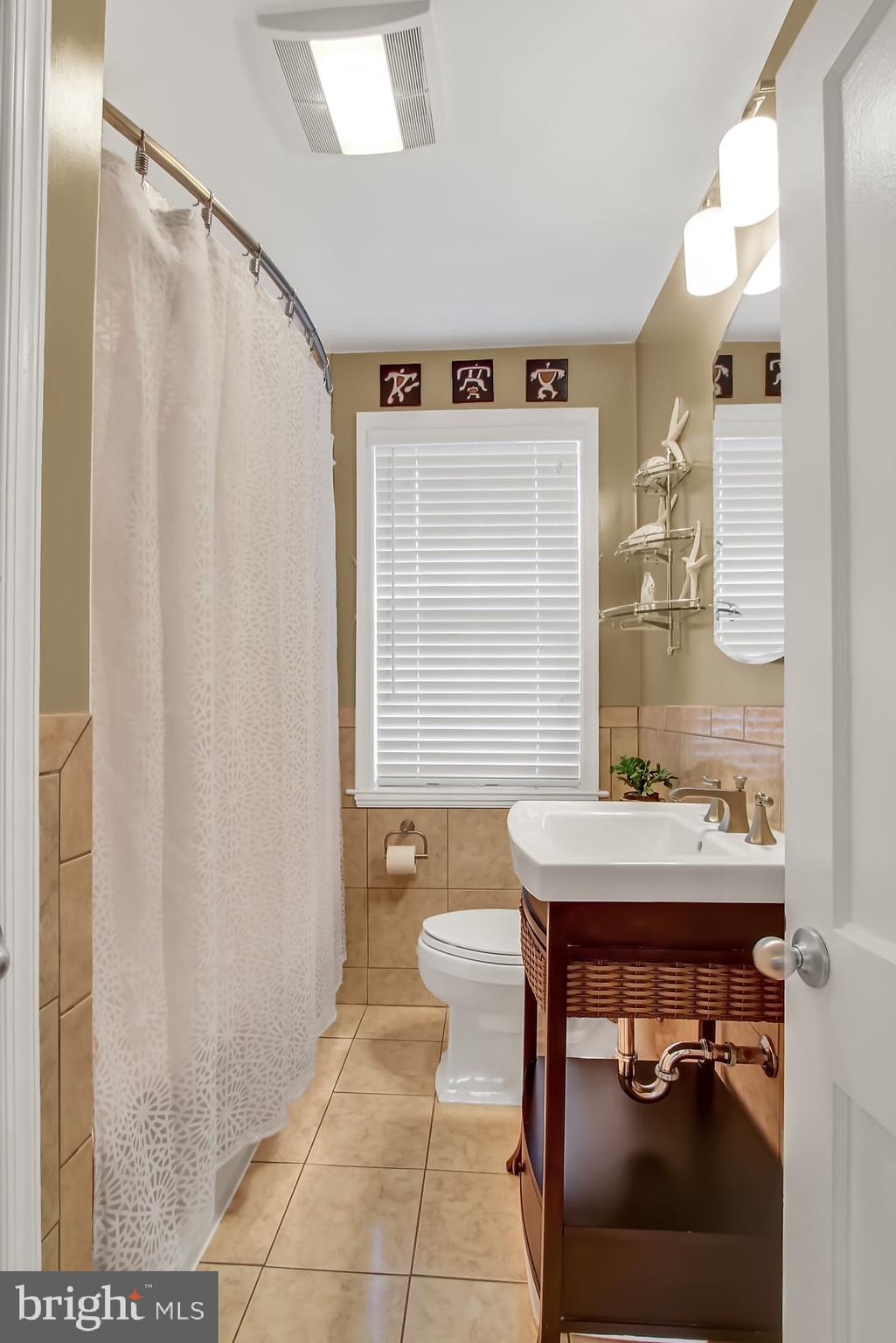 8159 Glen Gary Road Towson, MD 21286 - Photo 33 of 48 Bathroom w/ceramic tile flooring & wainscoting