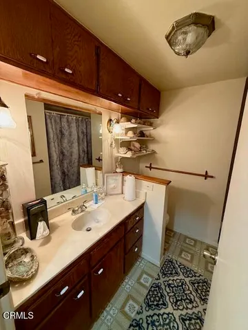 a kitchen with stainless steel appliances granite countertop a refrigerator stove and a sink