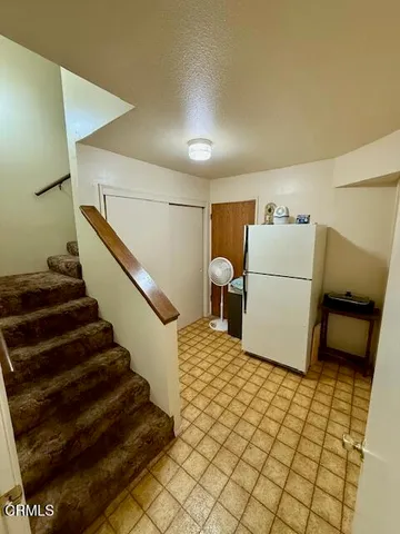 a bed room with a bed and a television