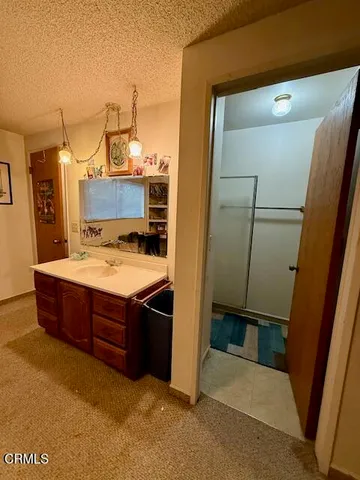 a bathroom with a toilet a sink and a mirror