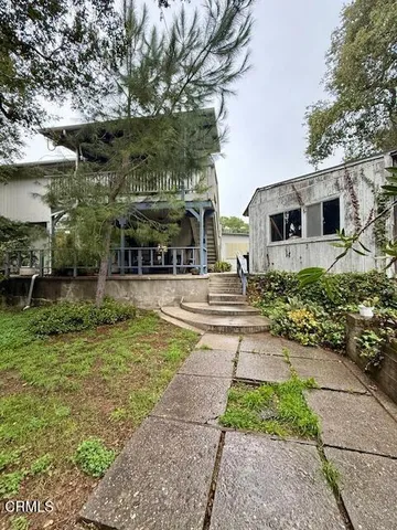 a view of a house with a street