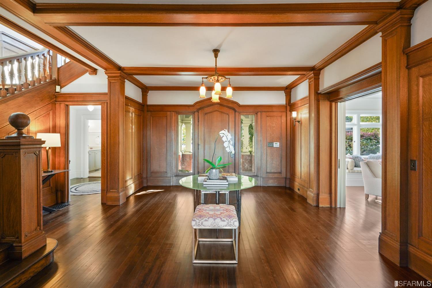 1314 Arch Street Berkeley, CA 94708 - Photo 17 of 90 a dining room with wooden floor a chandelier a glass table and chairs