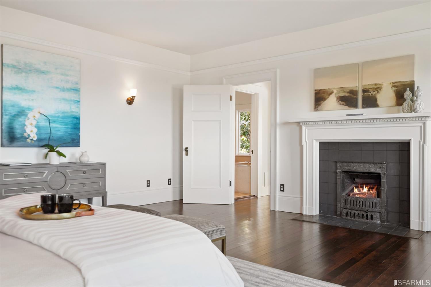 1314 Arch Street Berkeley, CA 94708 - Photo 27 of 90 a bedroom with a bed and a fireplace