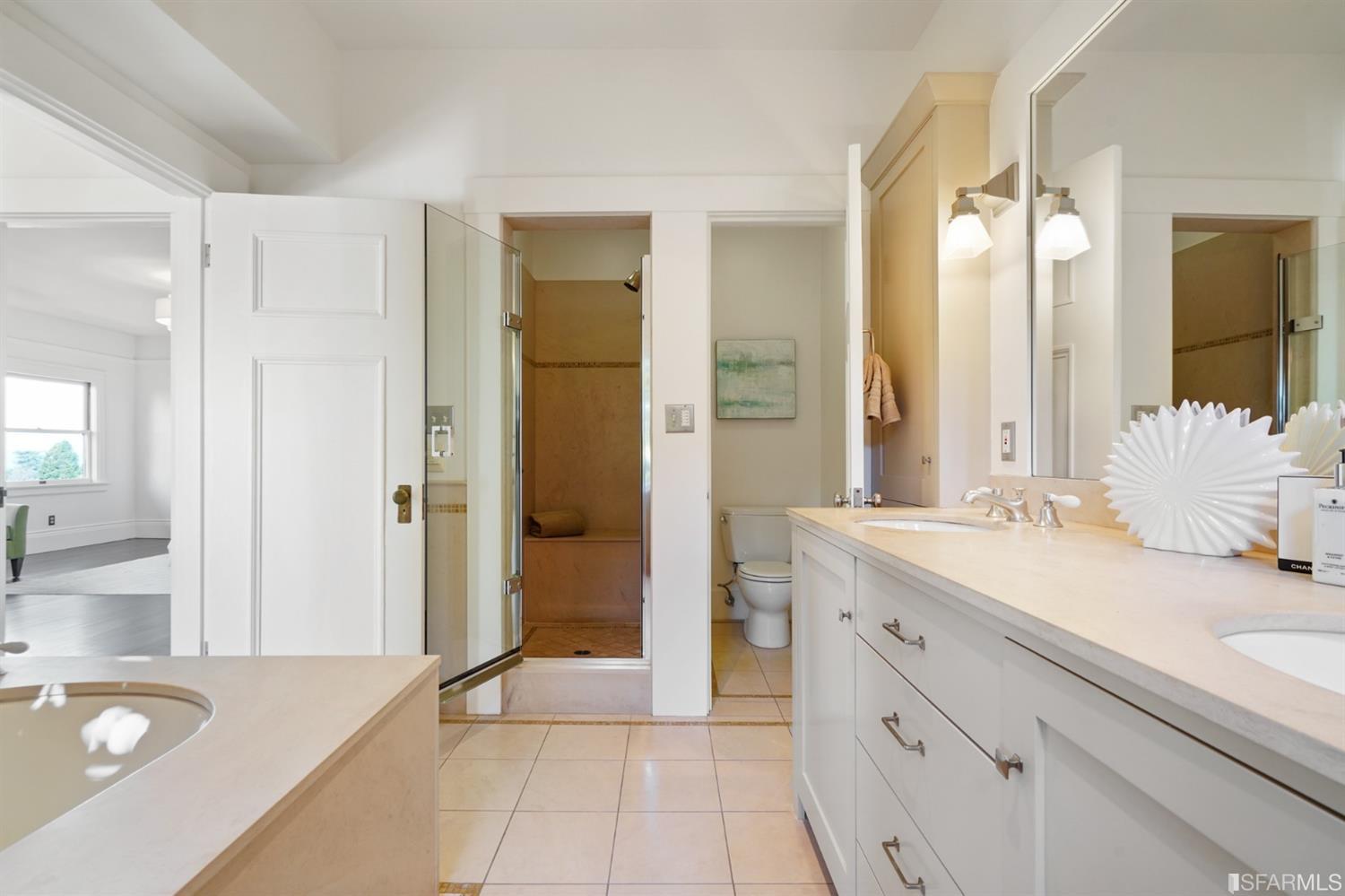 1314 Arch Street Berkeley, CA 94708 - Photo 29 of 90 a spacious bathroom with a granite countertop sink and a mirror