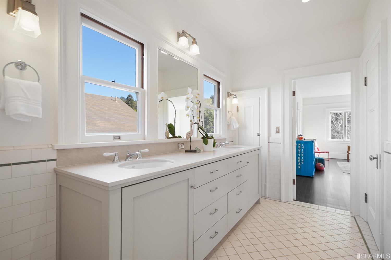 1314 Arch Street Berkeley, CA 94708 - Photo 36 of 90 a bathroom with a sink a mirror and a shower